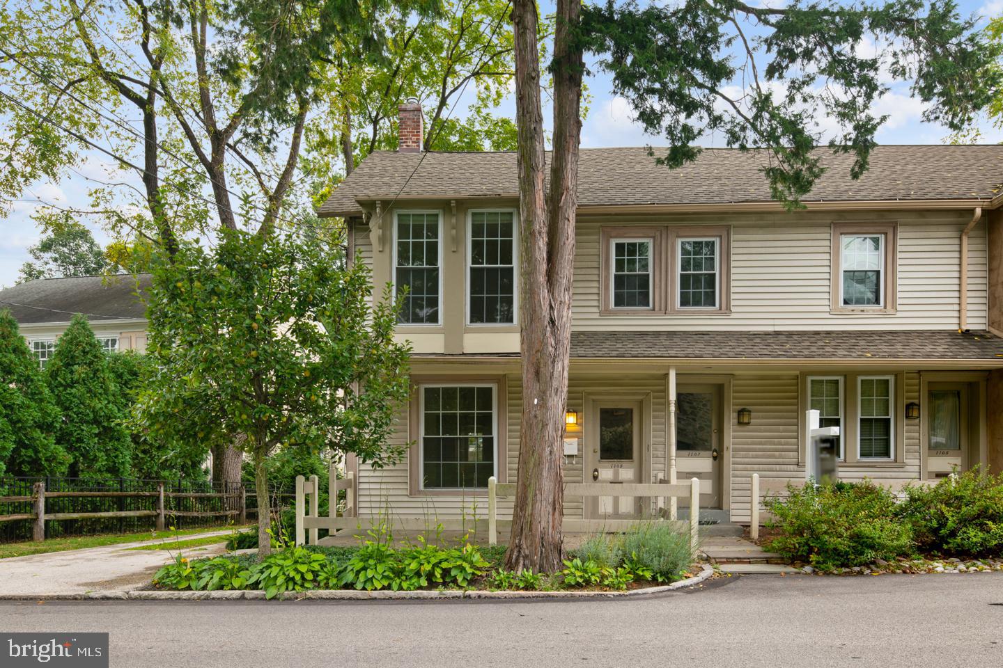 front view of a house with a garden