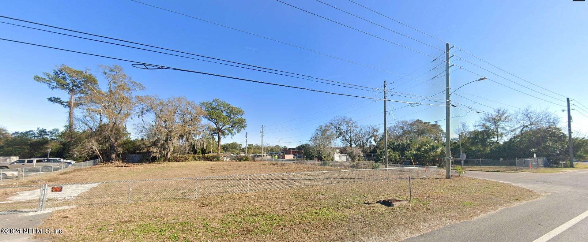 a view of a road with a building in the background