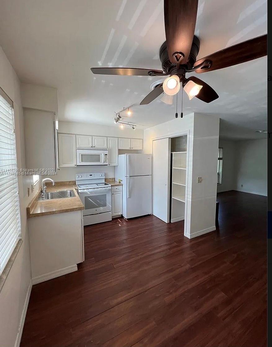 a kitchen with stainless steel appliances granite countertop a stove and a refrigerator