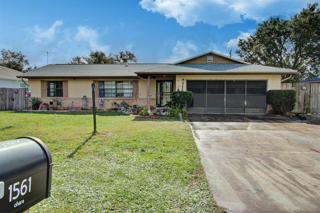 a front view of a house with a yard and porch