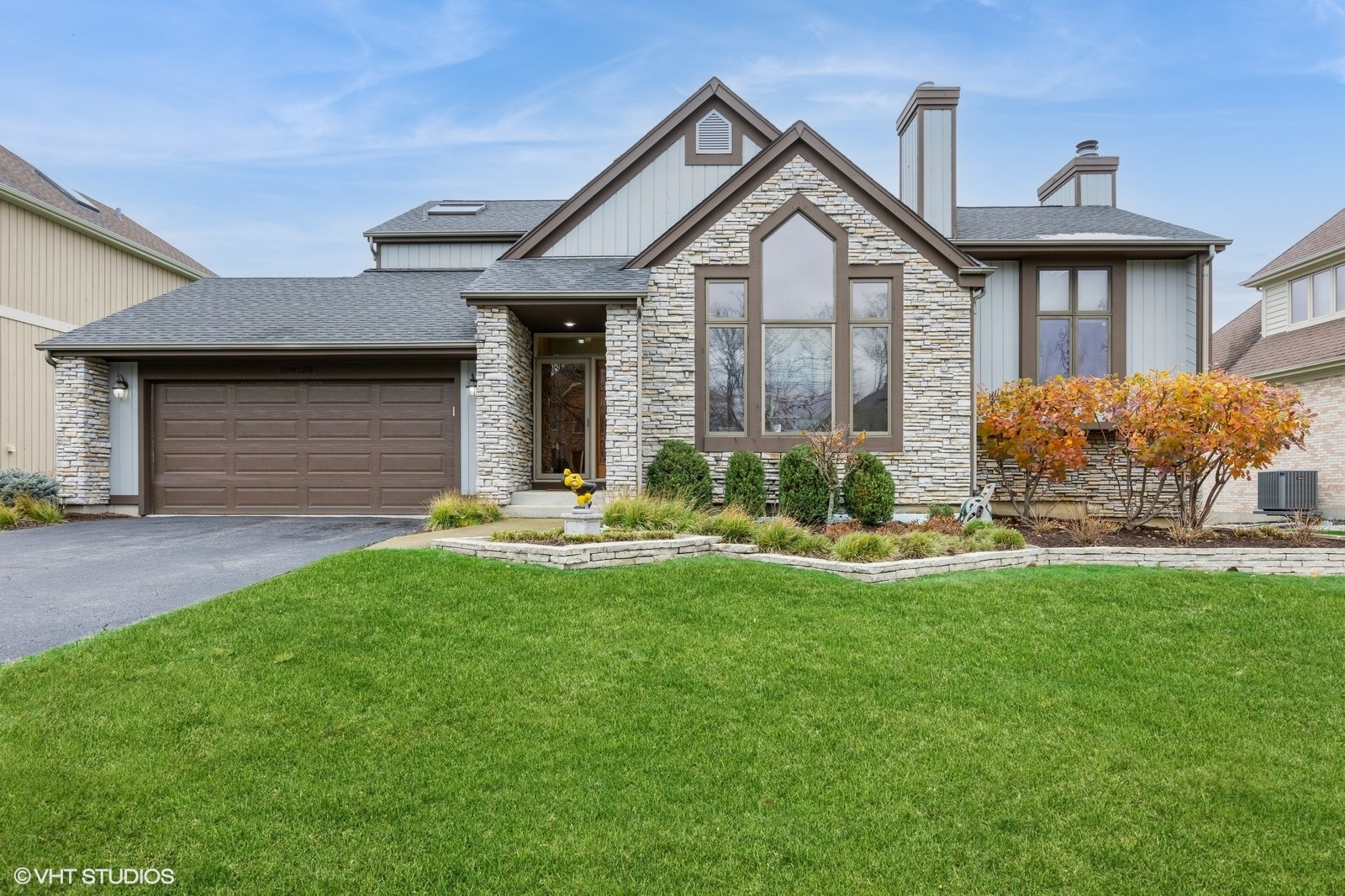 a front view of a house with a yard