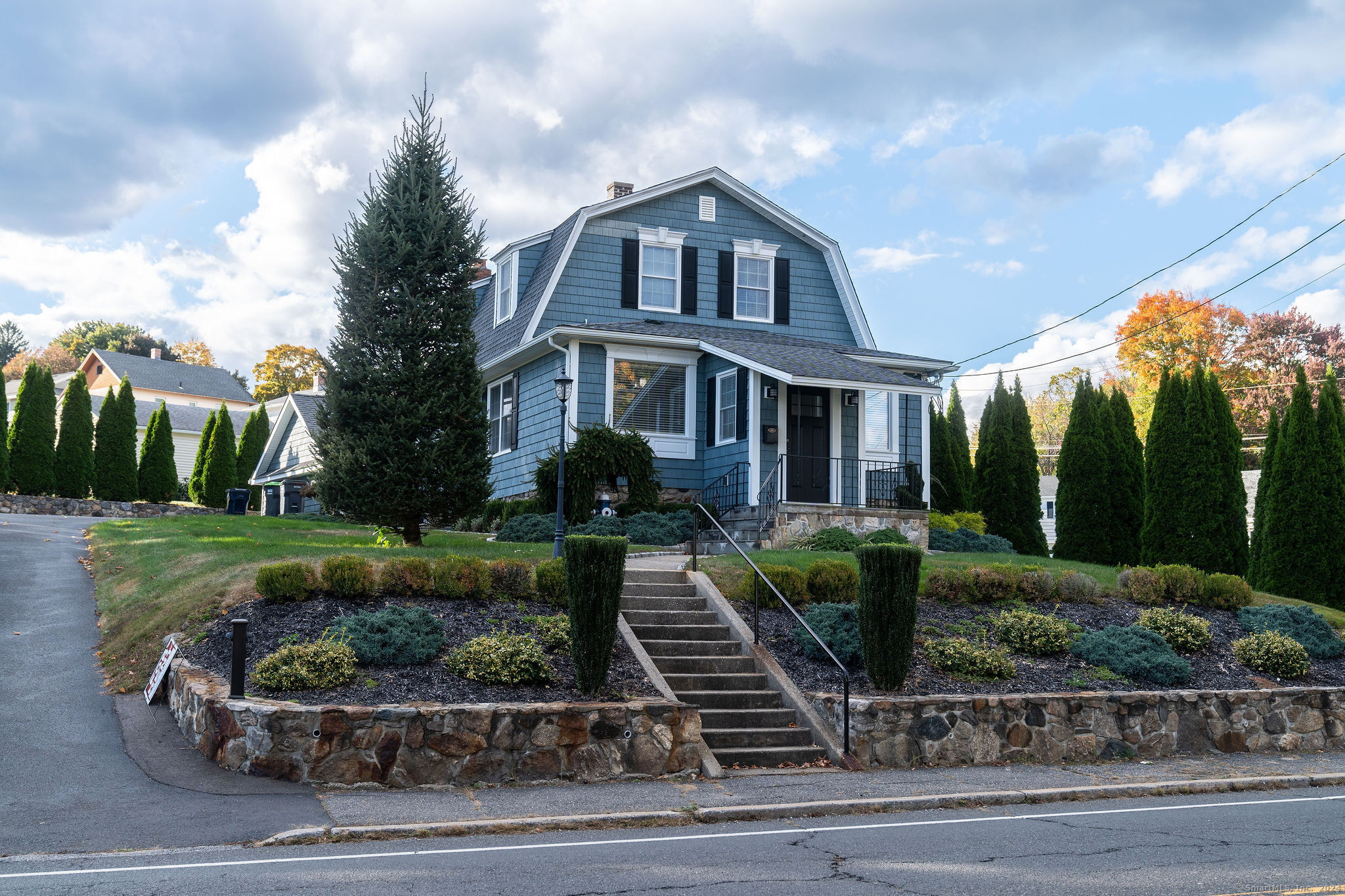 a front view of a house with a yard