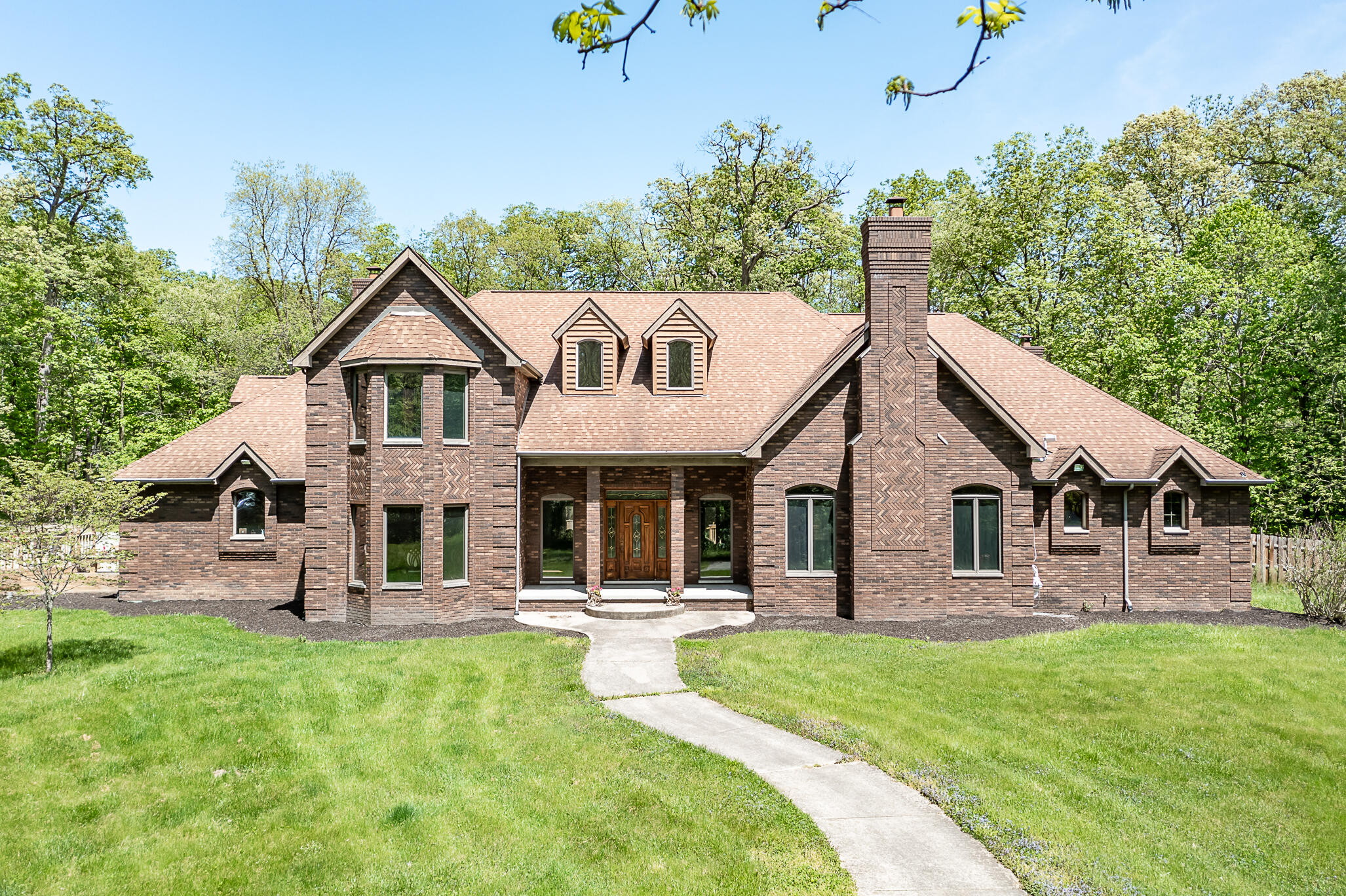 a front view of a house with a yard