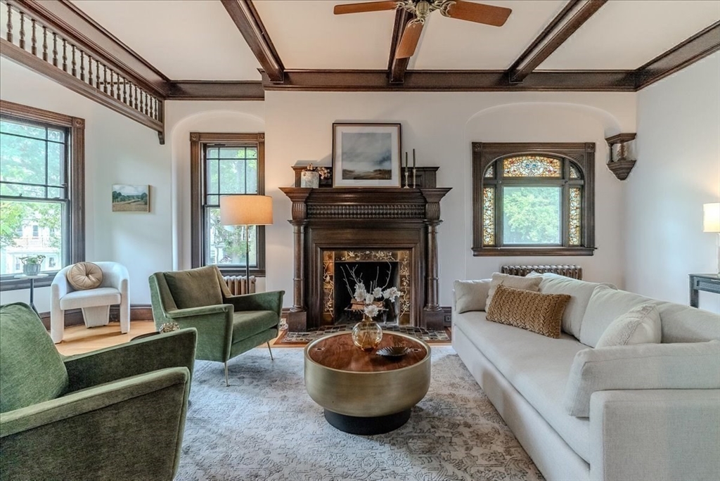 a living room with furniture and a fireplace