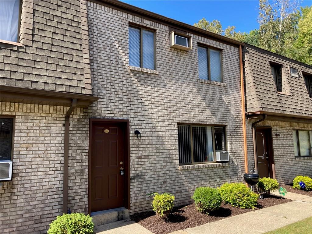 a brick house with a small entryway