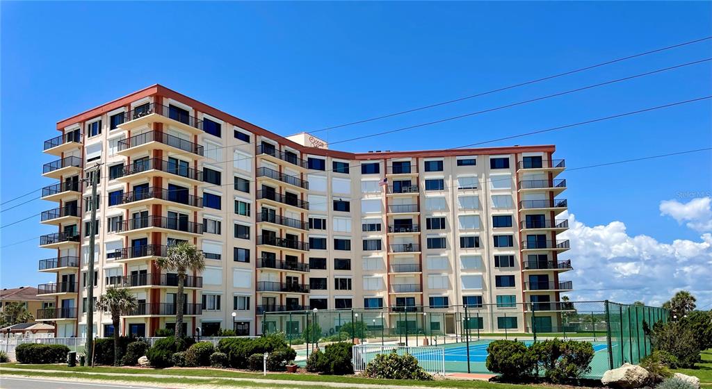 a view of a building with a street