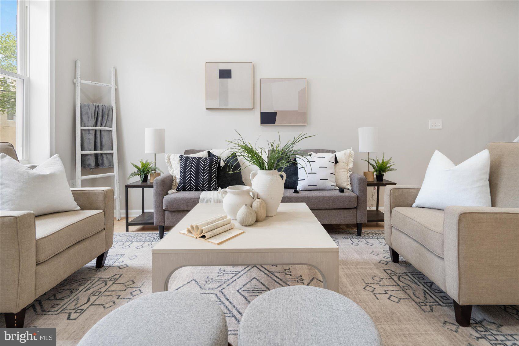 a living room with furniture and a large window