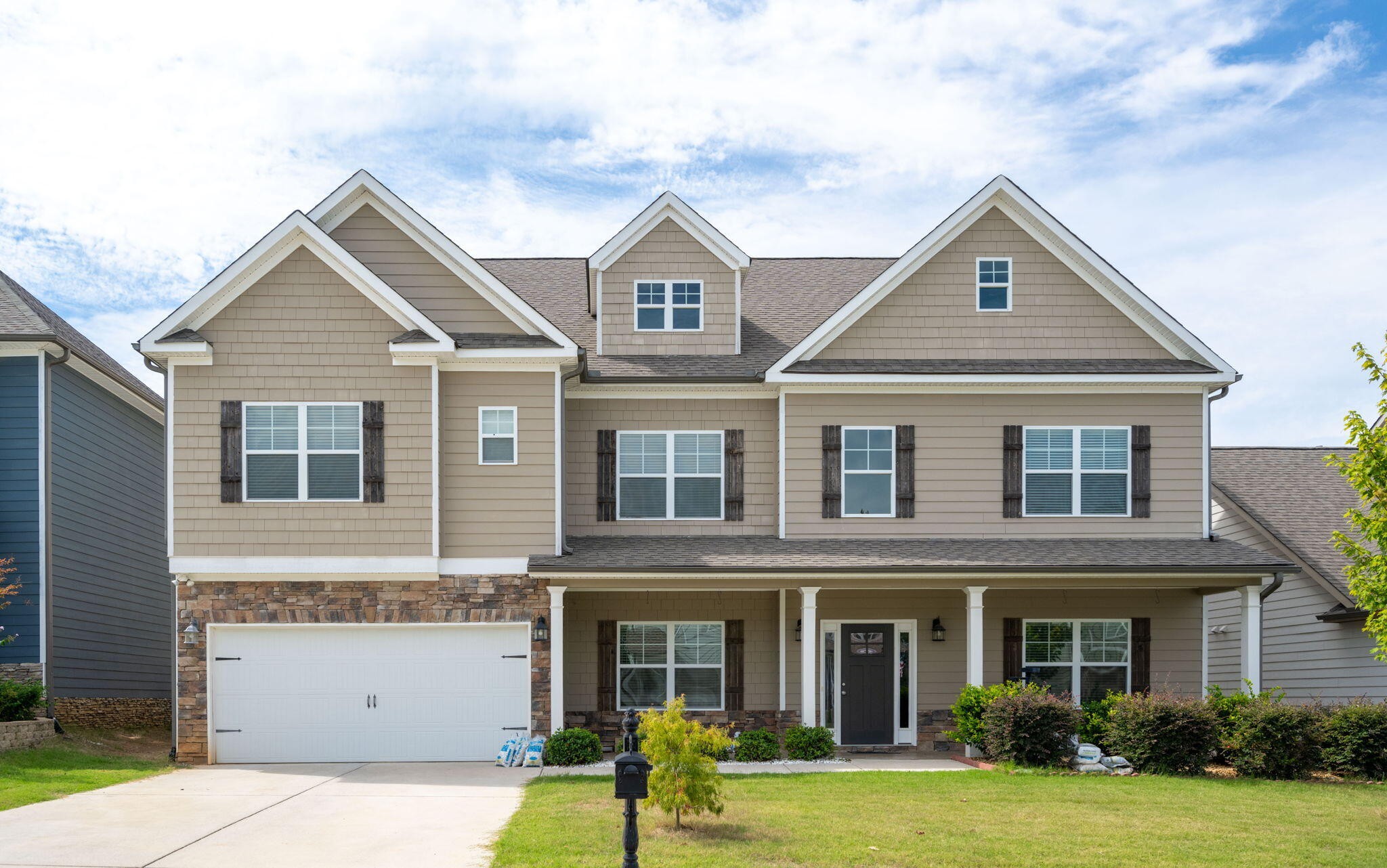 front view of a house with a yard