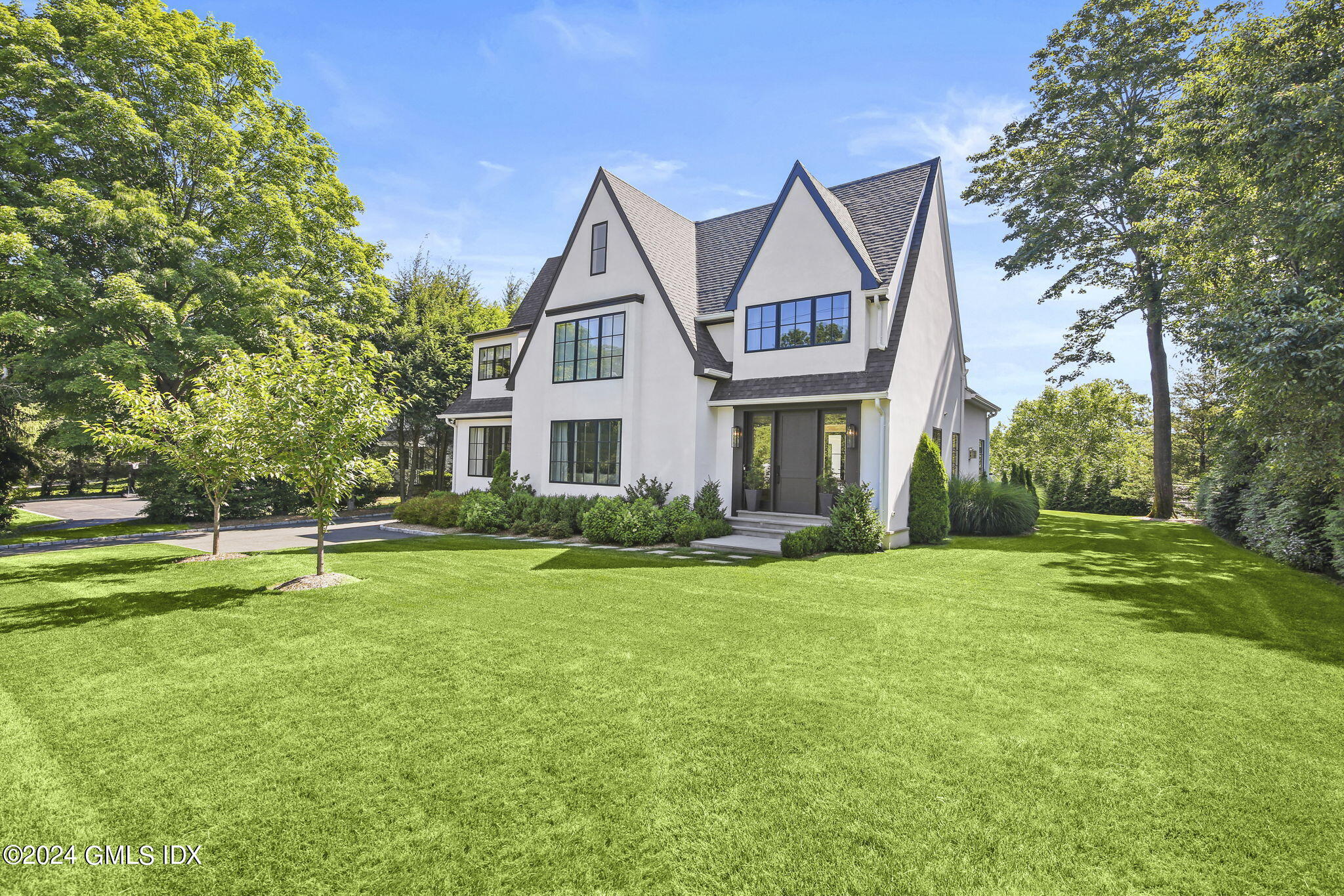 a front view of a house with a yard