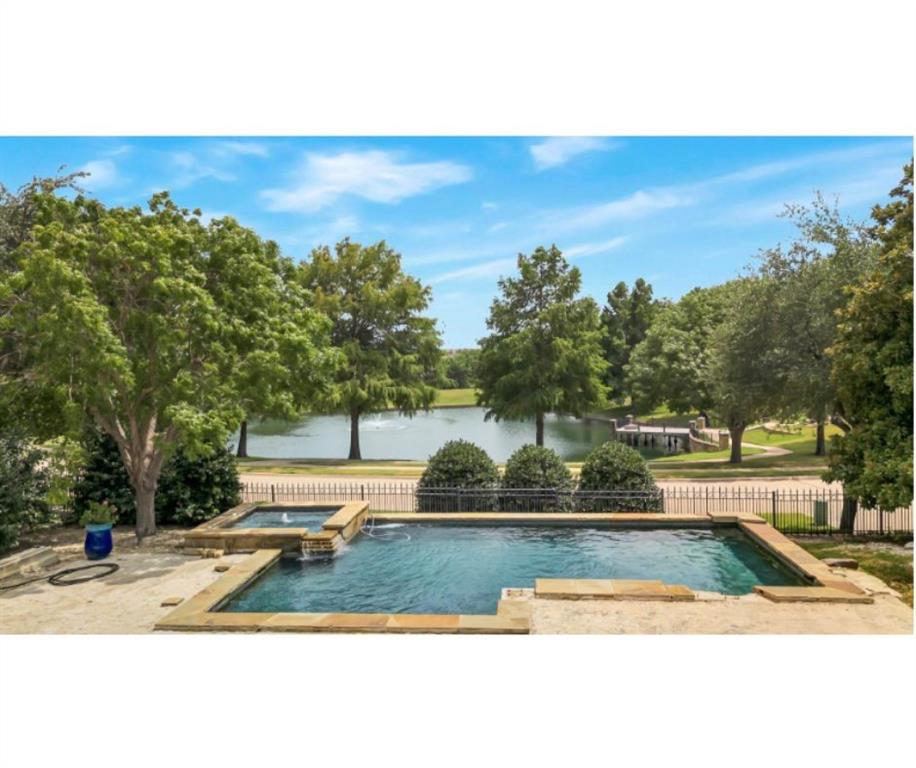 a view of a swimming pool with an outdoor seating