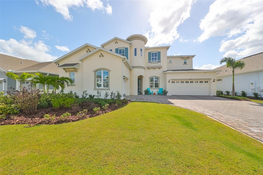 a front view of a house with a yard