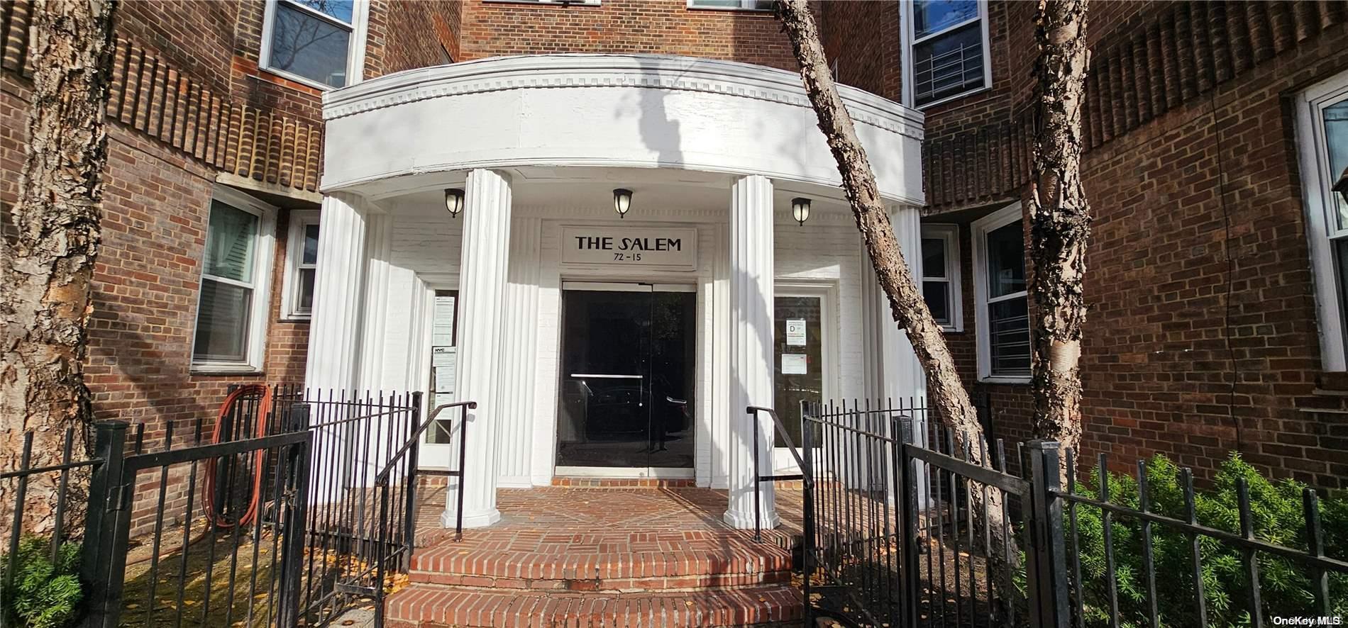 a front view of a building with a glass door