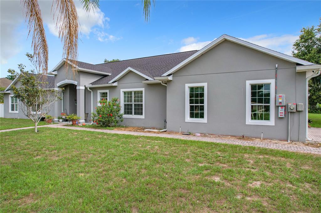 a front view of a house with a yard