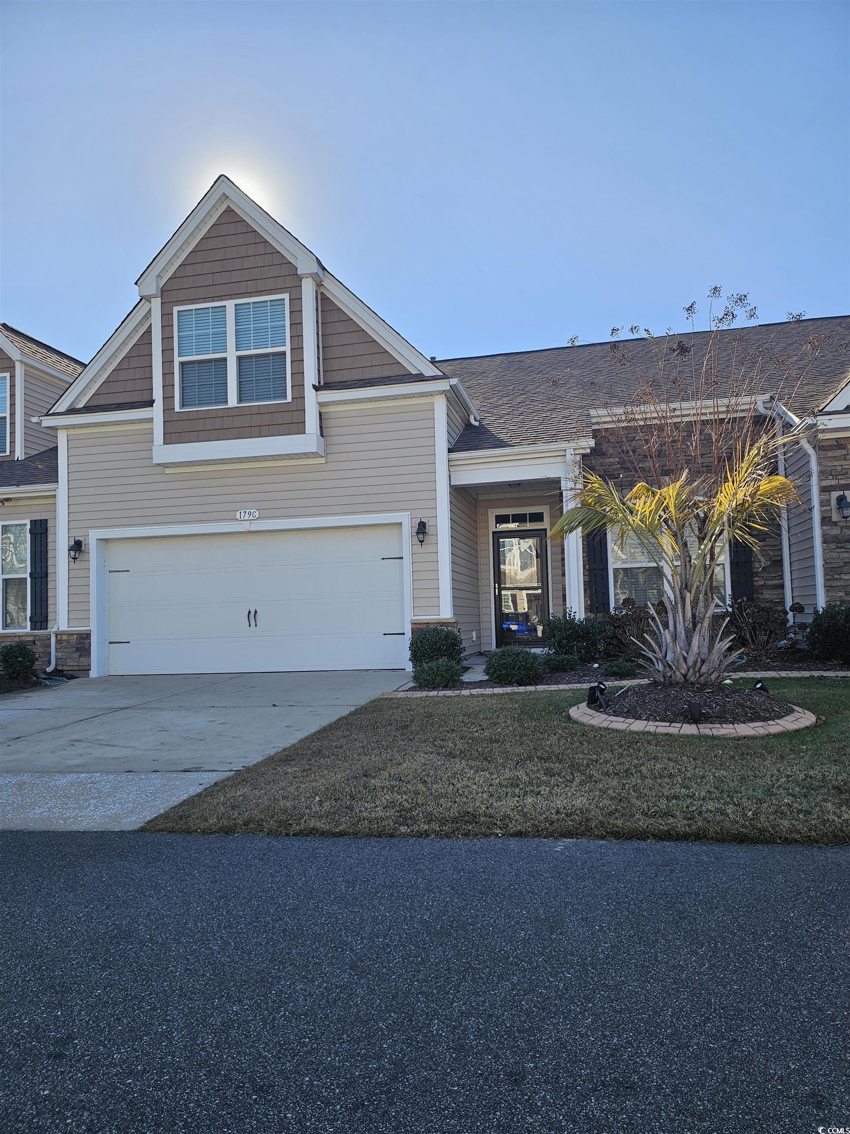 View of front of property with a garage