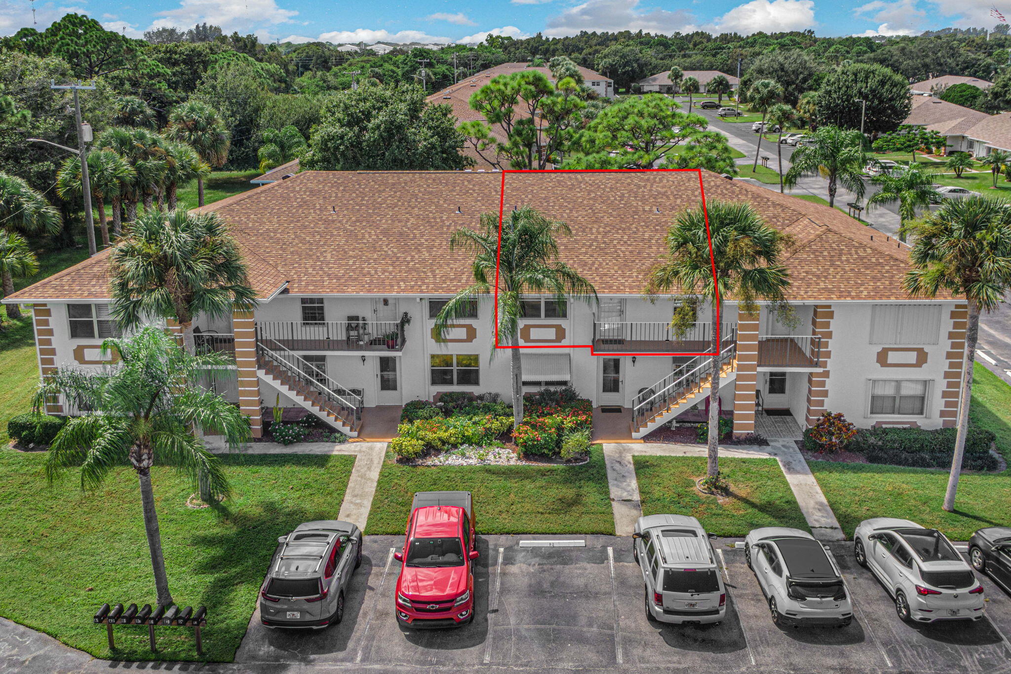 aerial view of a house with garden space and plants