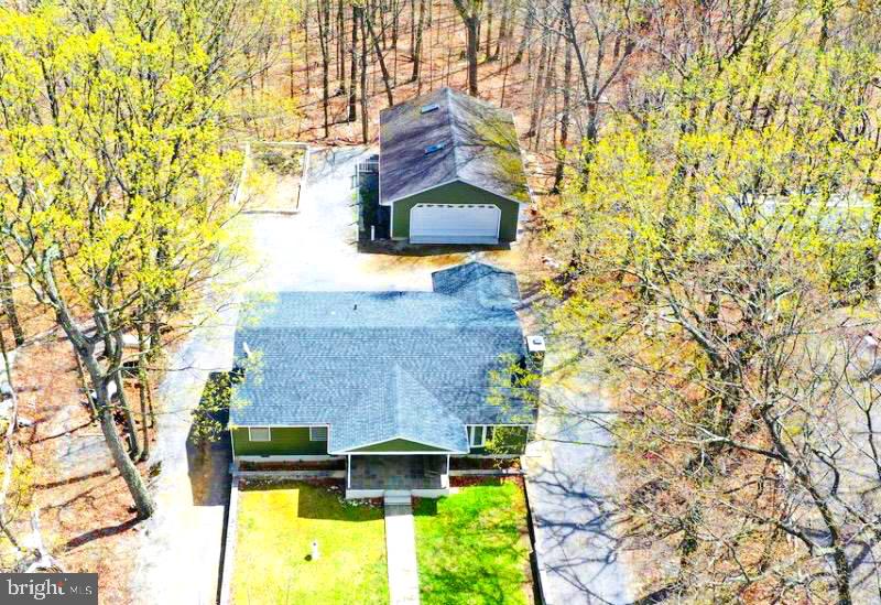 a aerial view of a house with a yard