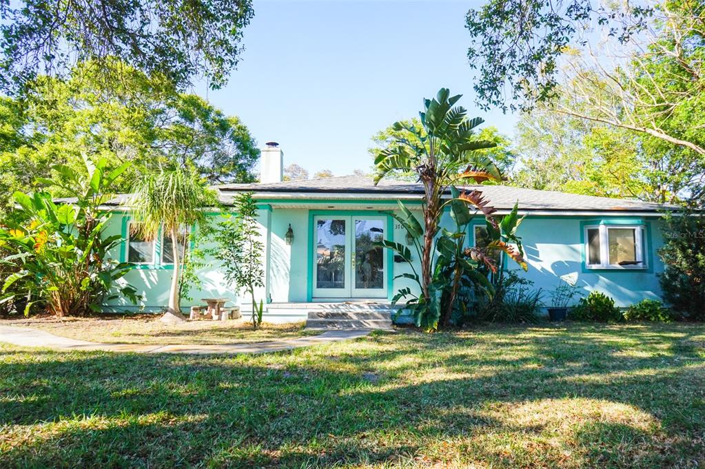 a front view of a house with garden