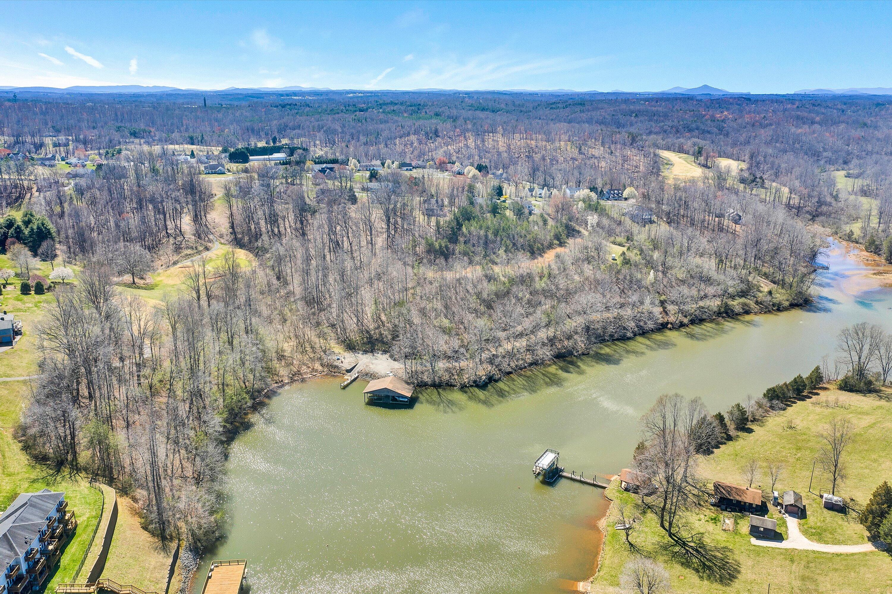 an aerial view of a house with a lake view