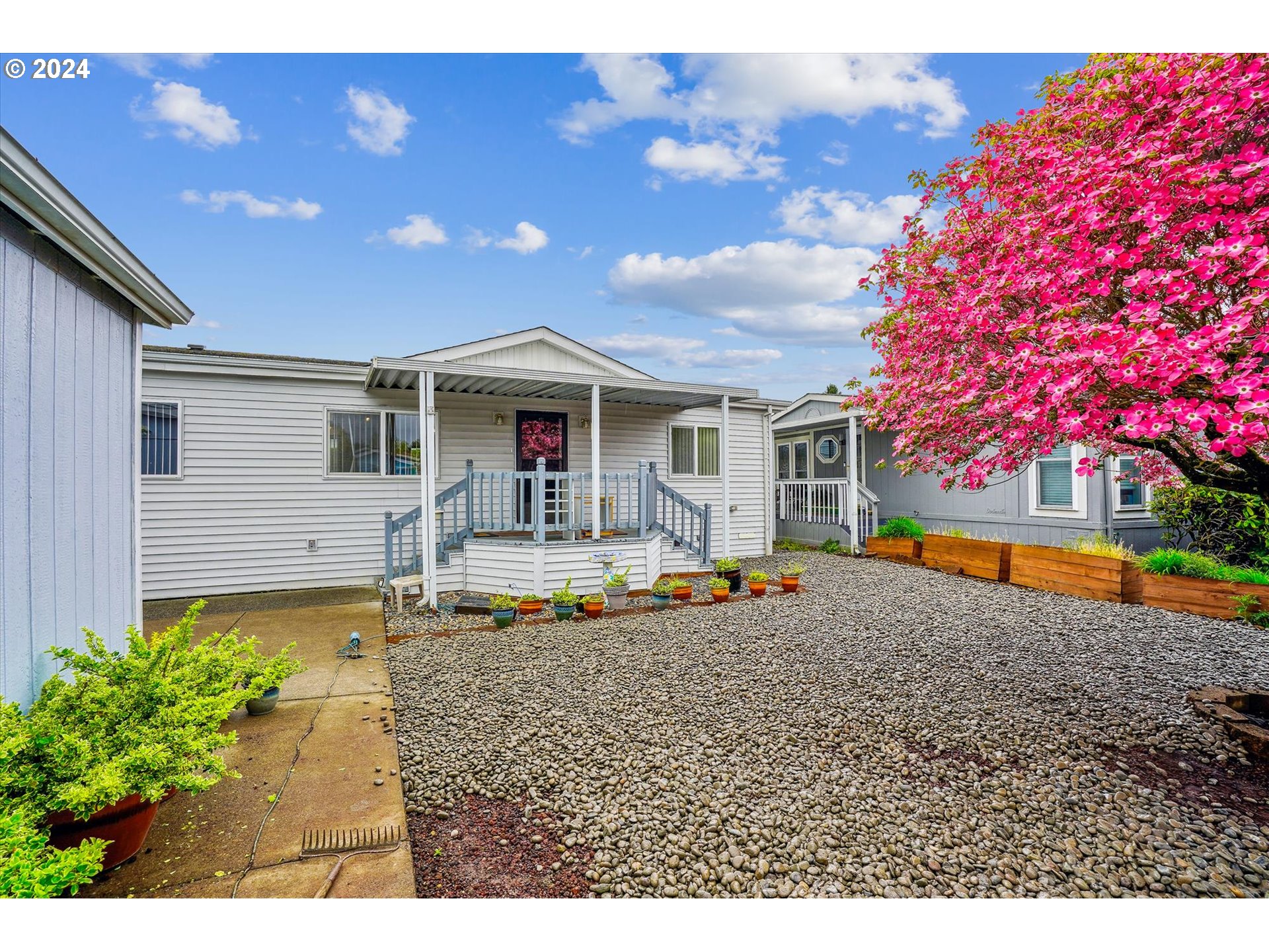 a house view with swimming pool and wooden bench