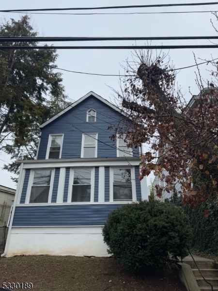 a view of a house with a street