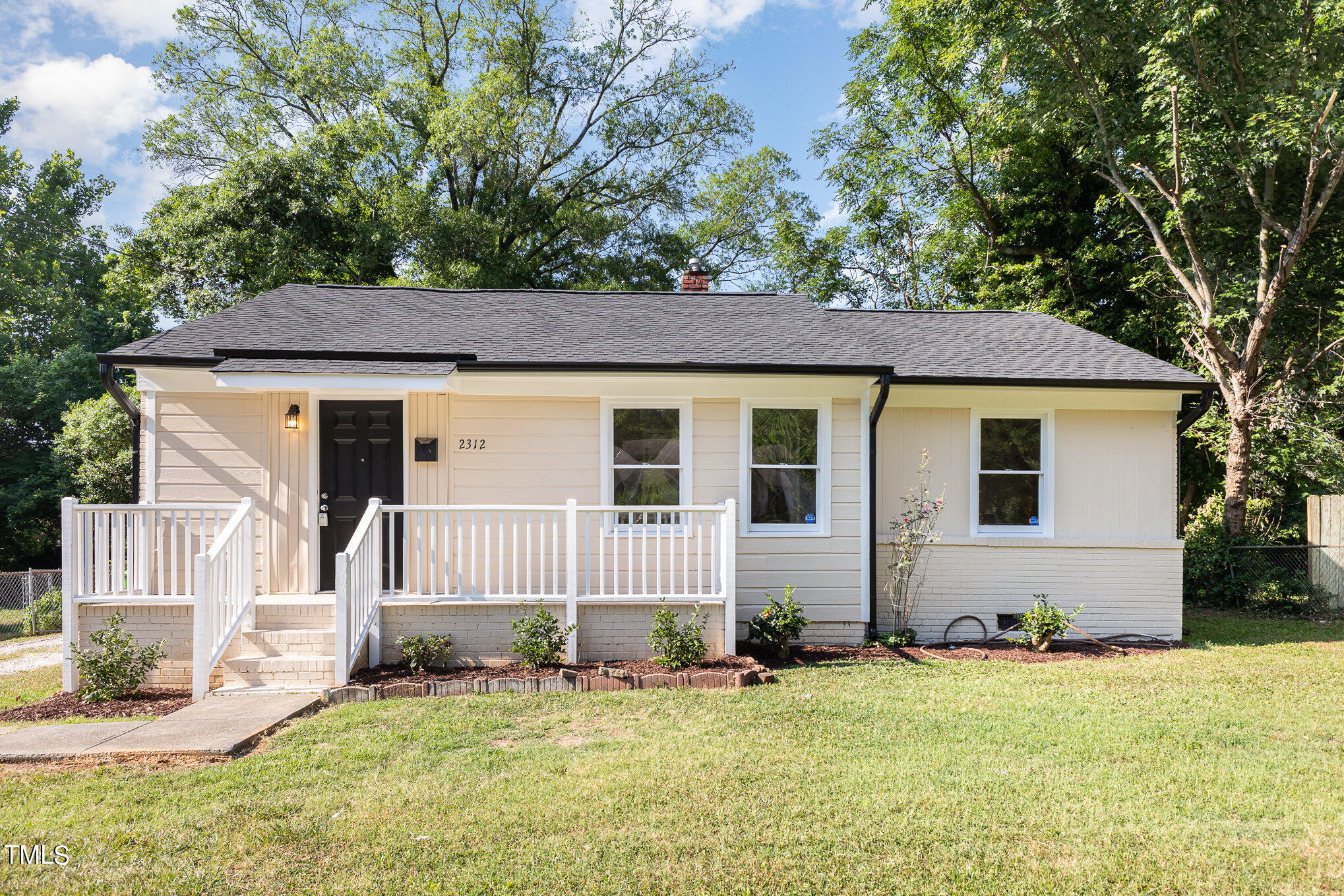 front view of a house with a yard