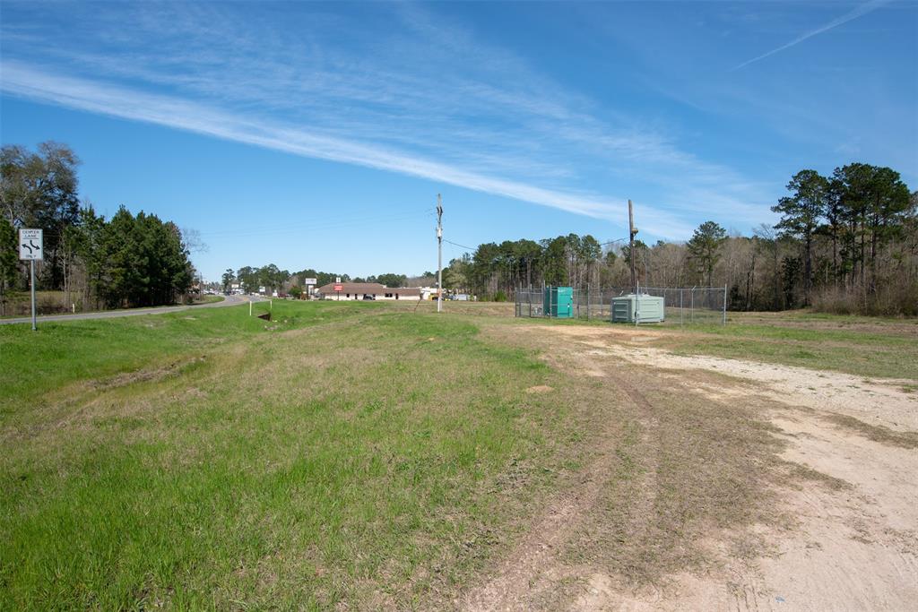 a view of a field with ocean view