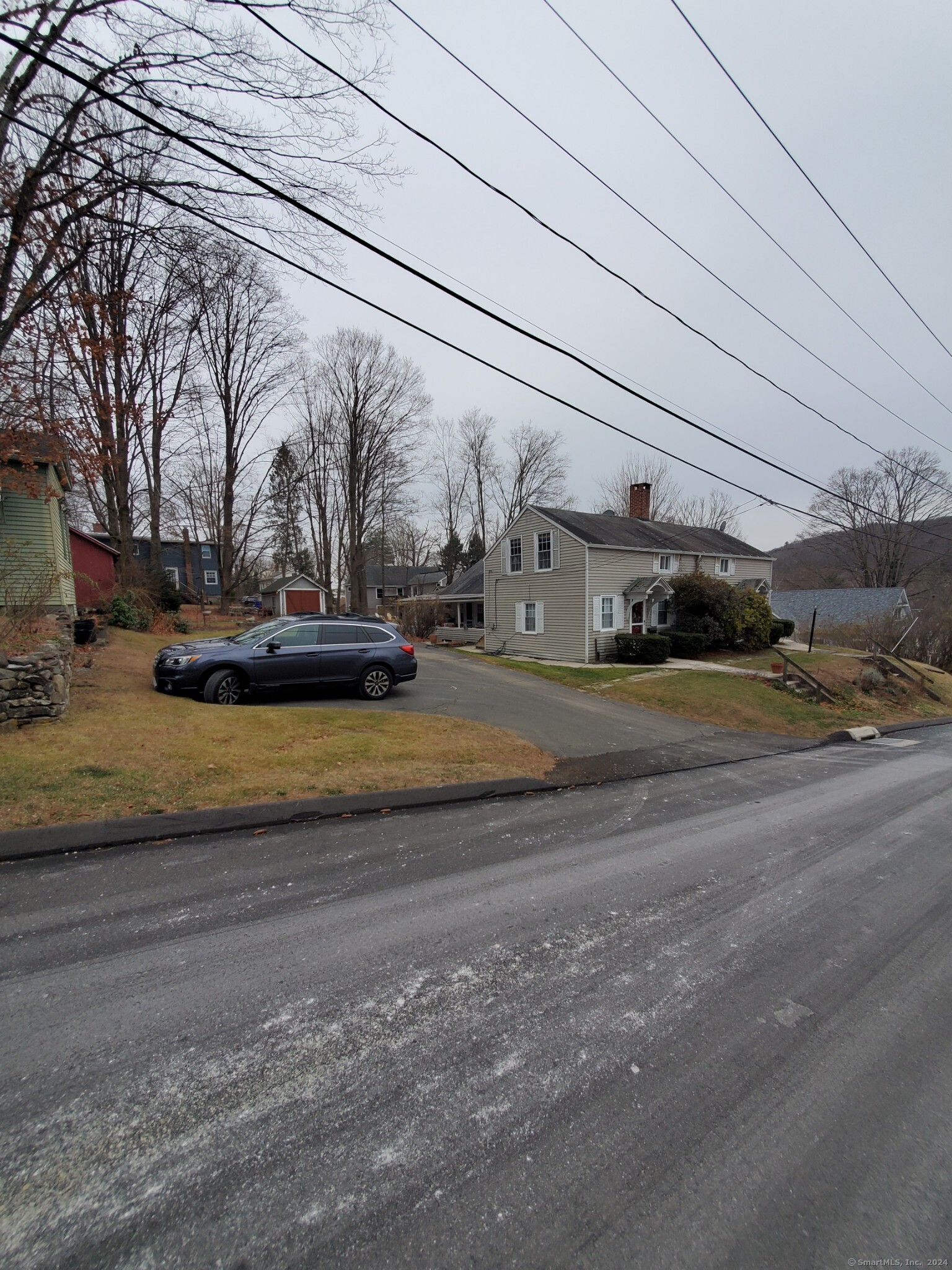 a view of street with parked cars