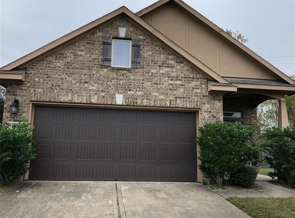 a front view of a house with garage