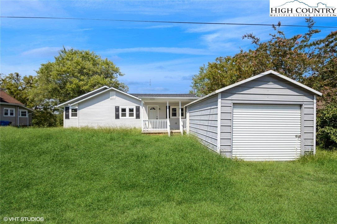 a view of a house with a yard