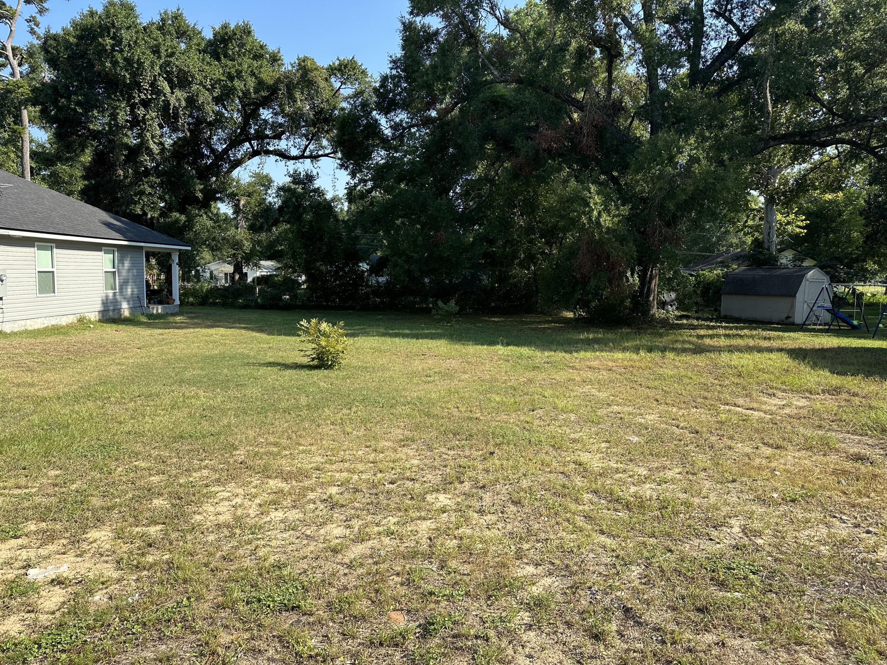 a view of a swimming pool with a yard