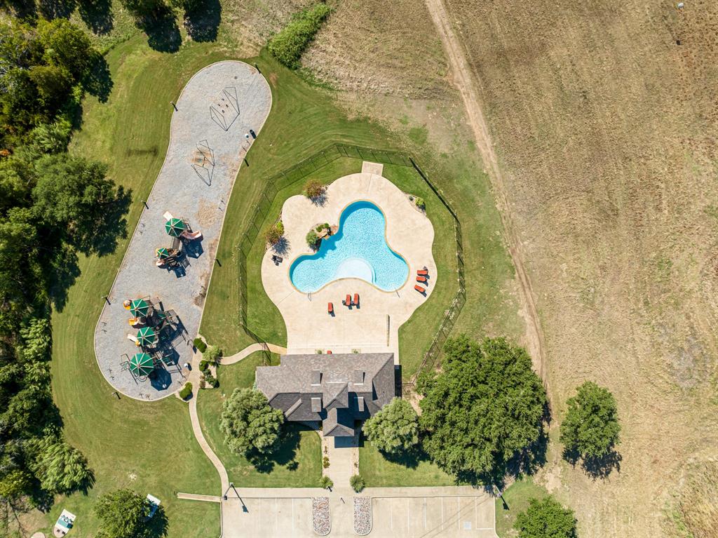 an aerial view of a house with a swimming pool