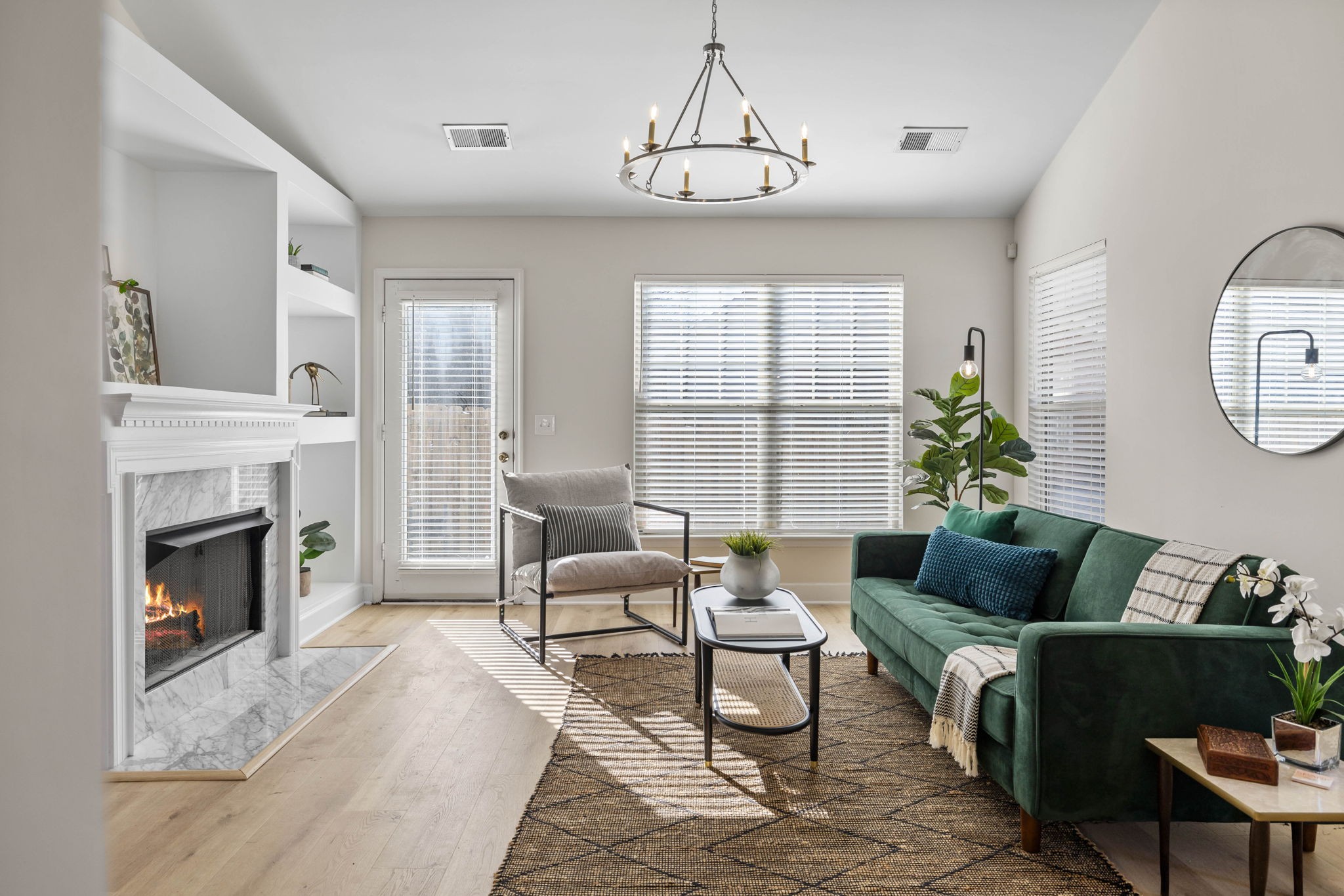 a living room with furniture and a fireplace