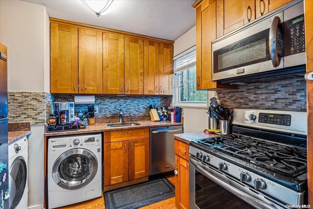 a kitchen with a stove and a sink