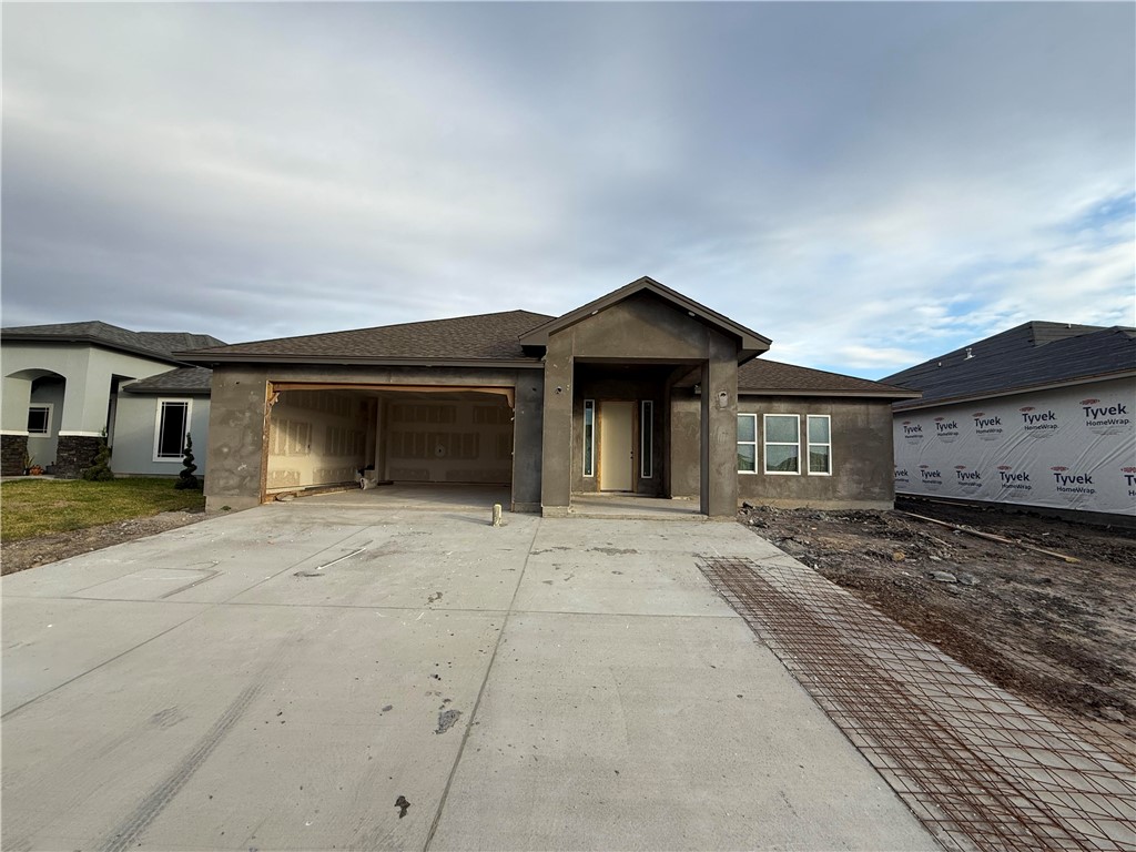 a front view of a house with parking space