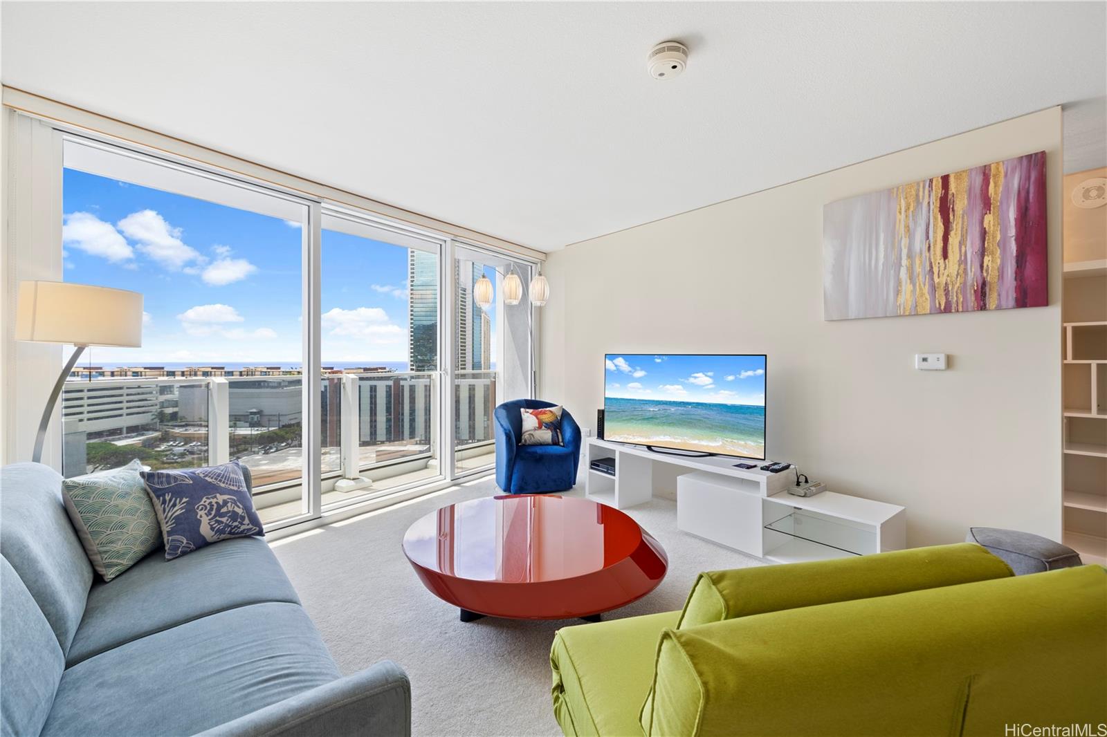 a living room with furniture and a flat screen tv