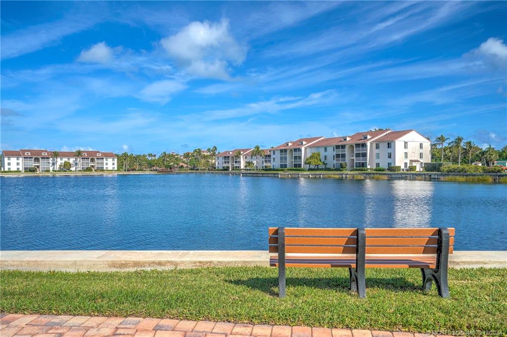 a view of a lake with houses in the back