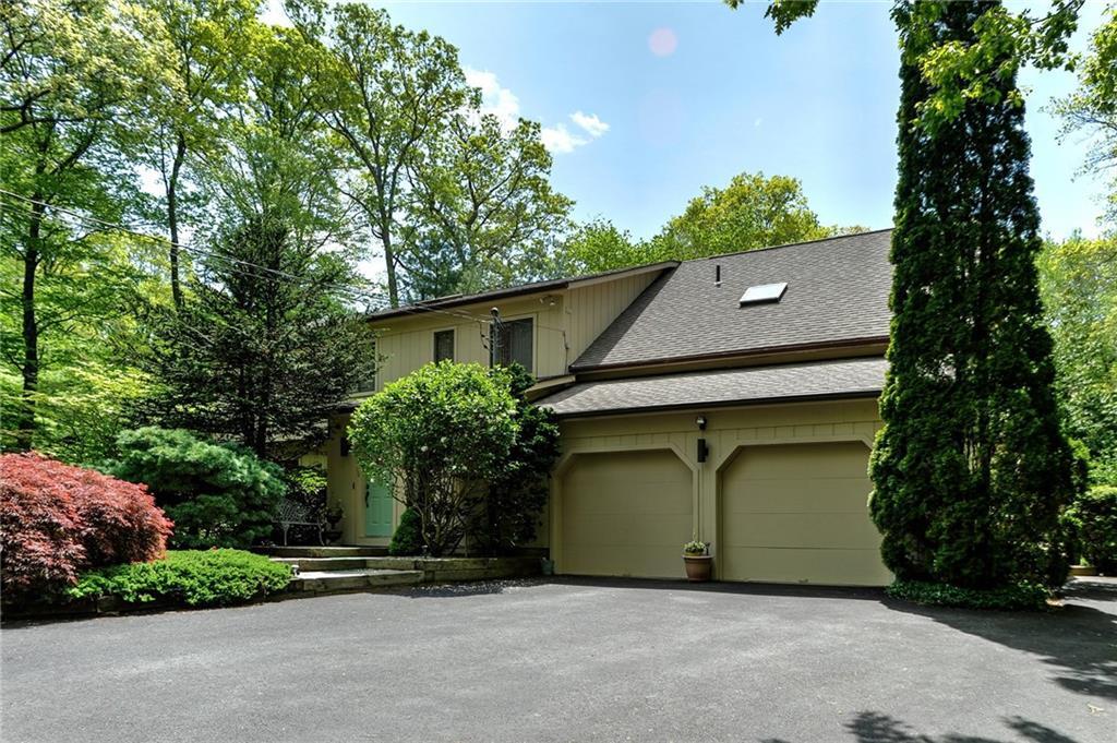 a house with a tree in front of it