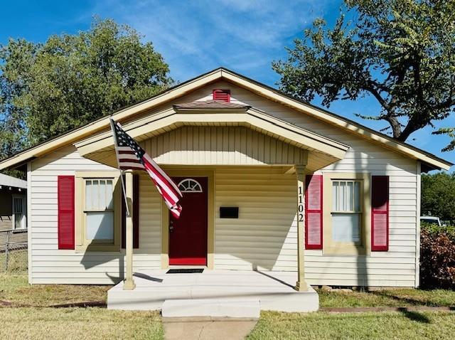 a front view of a house with garage