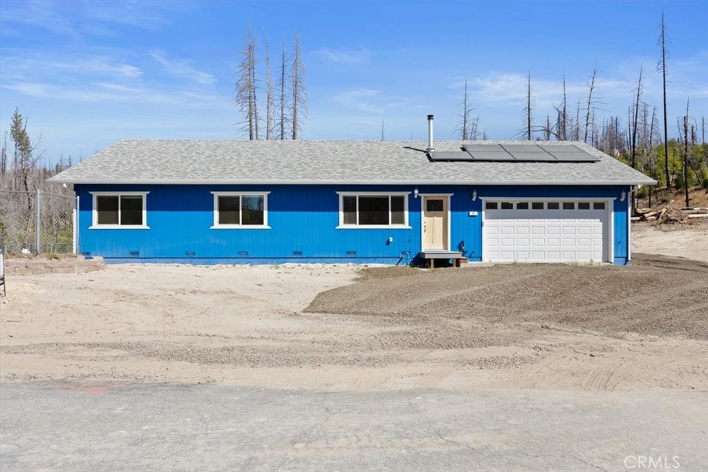 a front view of a house with a garage