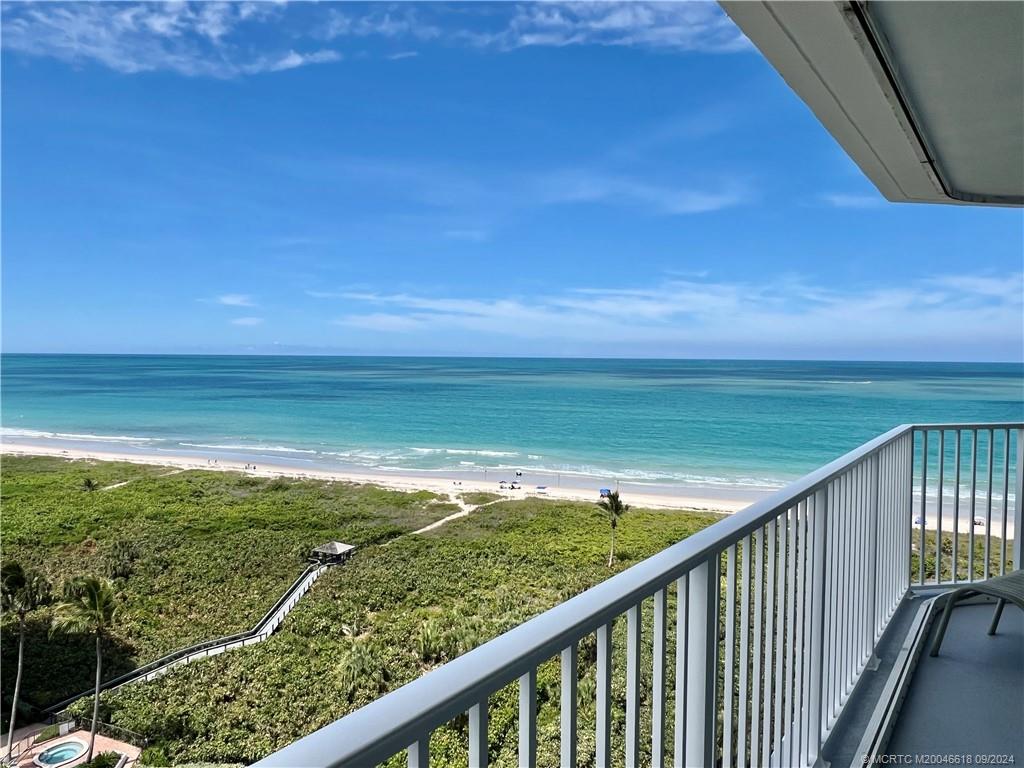 a view of a balcony with an ocean