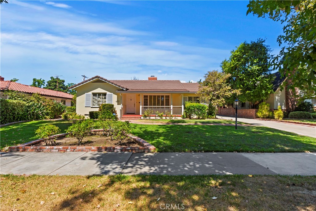 a front view of a house with garden