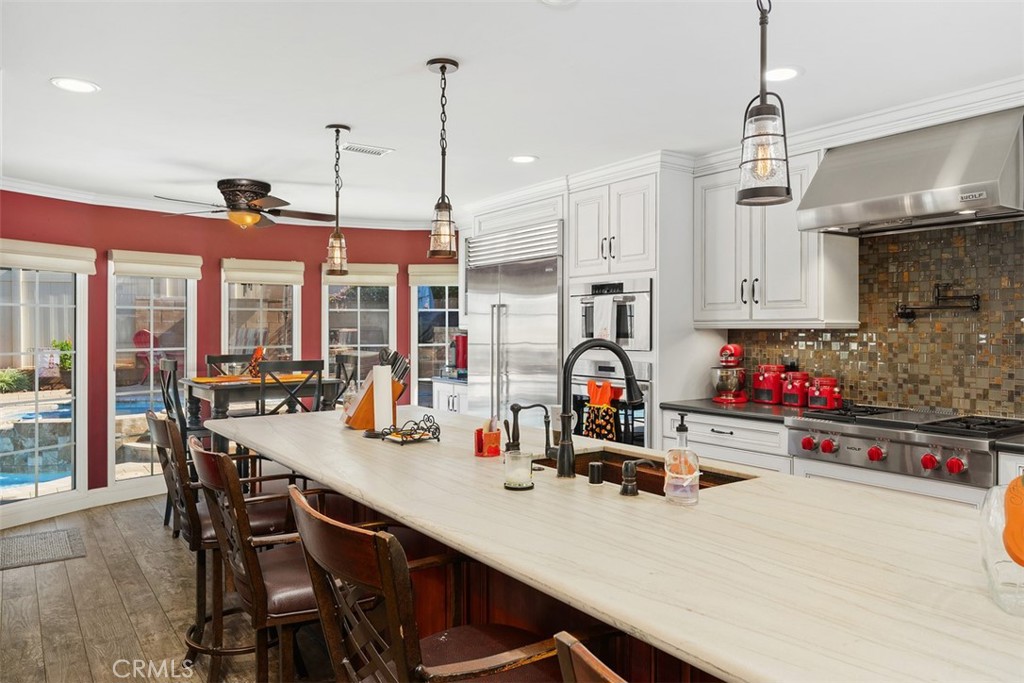 a view of a kitchen and dining room