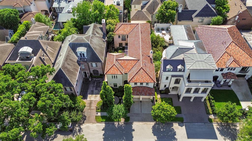 an aerial view of multiple houses with yard