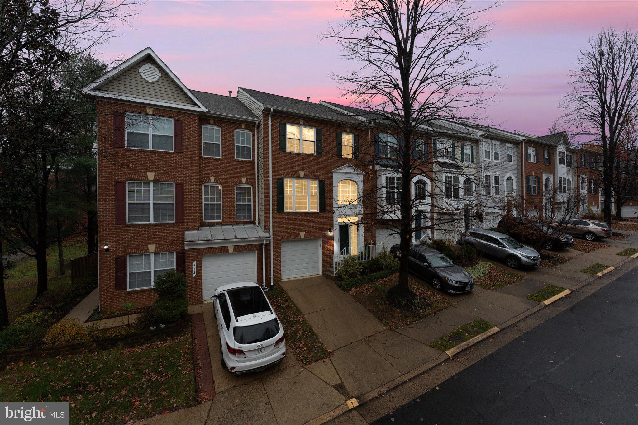 a front view of a house with parking area