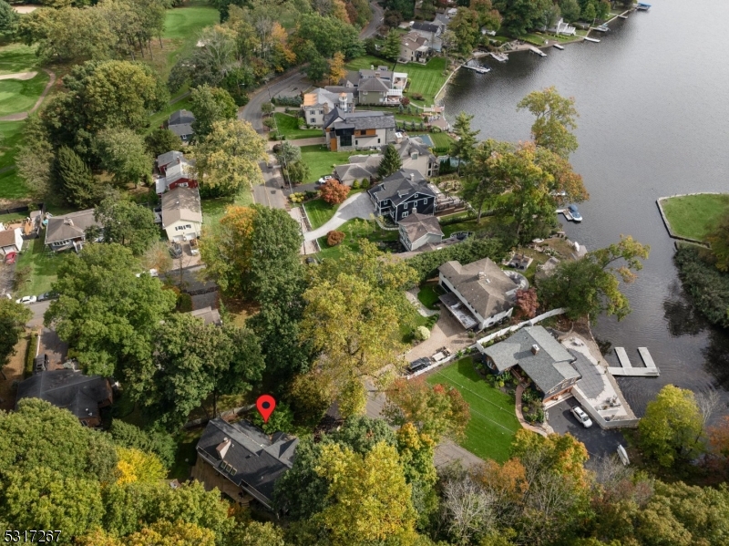 an aerial view of residential house with outdoor space and swimming pool