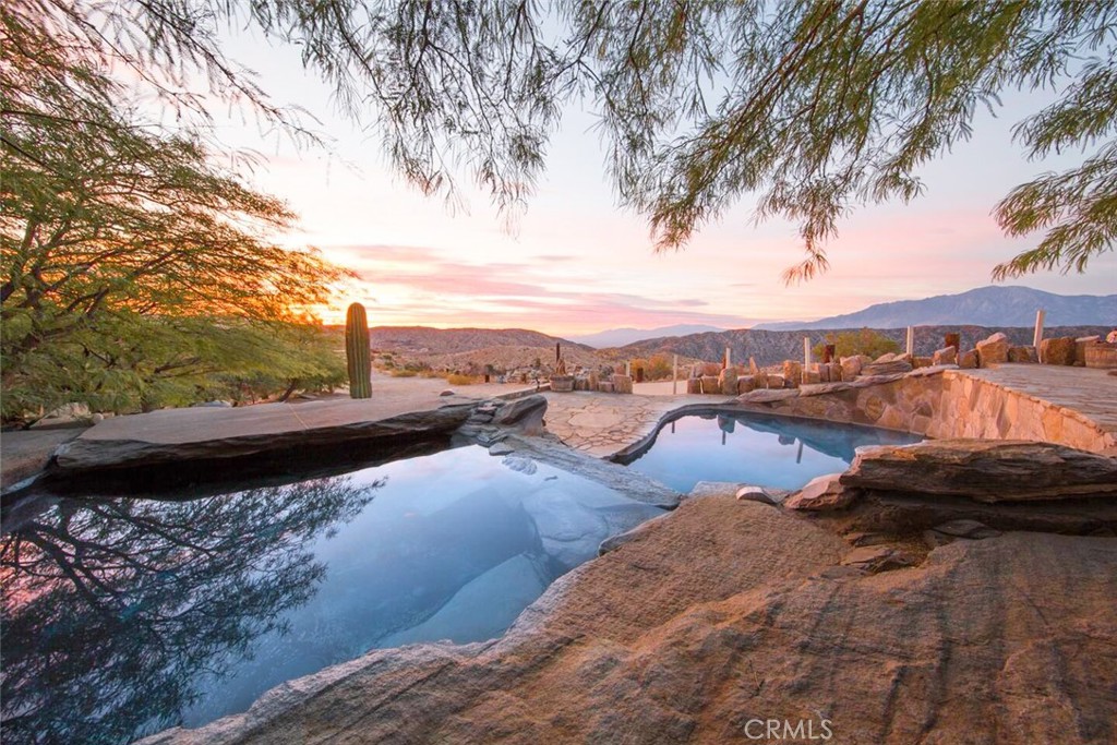 a view of swimming pool with a patio