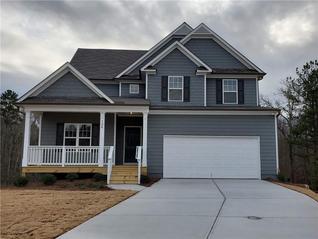 a front view of a house with a garage