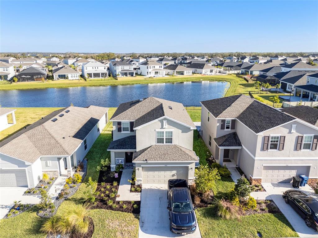 an aerial view of multiple houses with yard