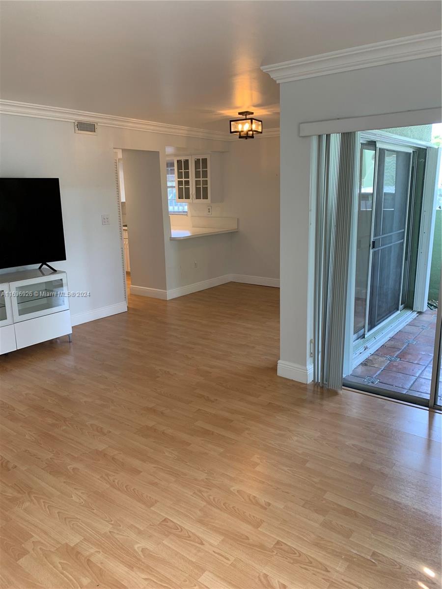 a view of livingroom with hardwood floor and a flat screen tv