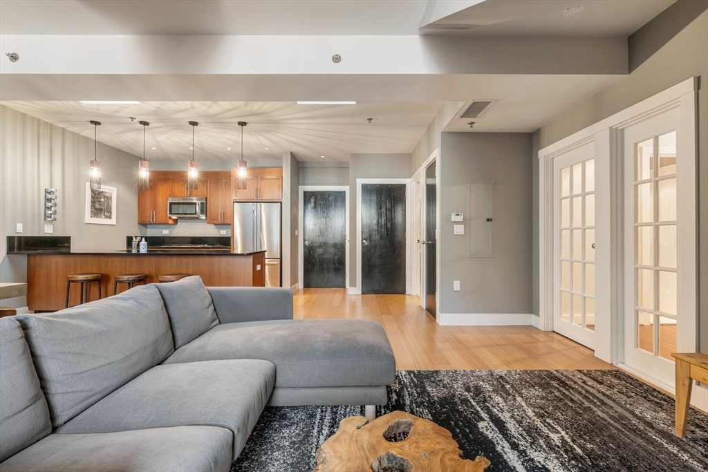 a living room with furniture and a large window